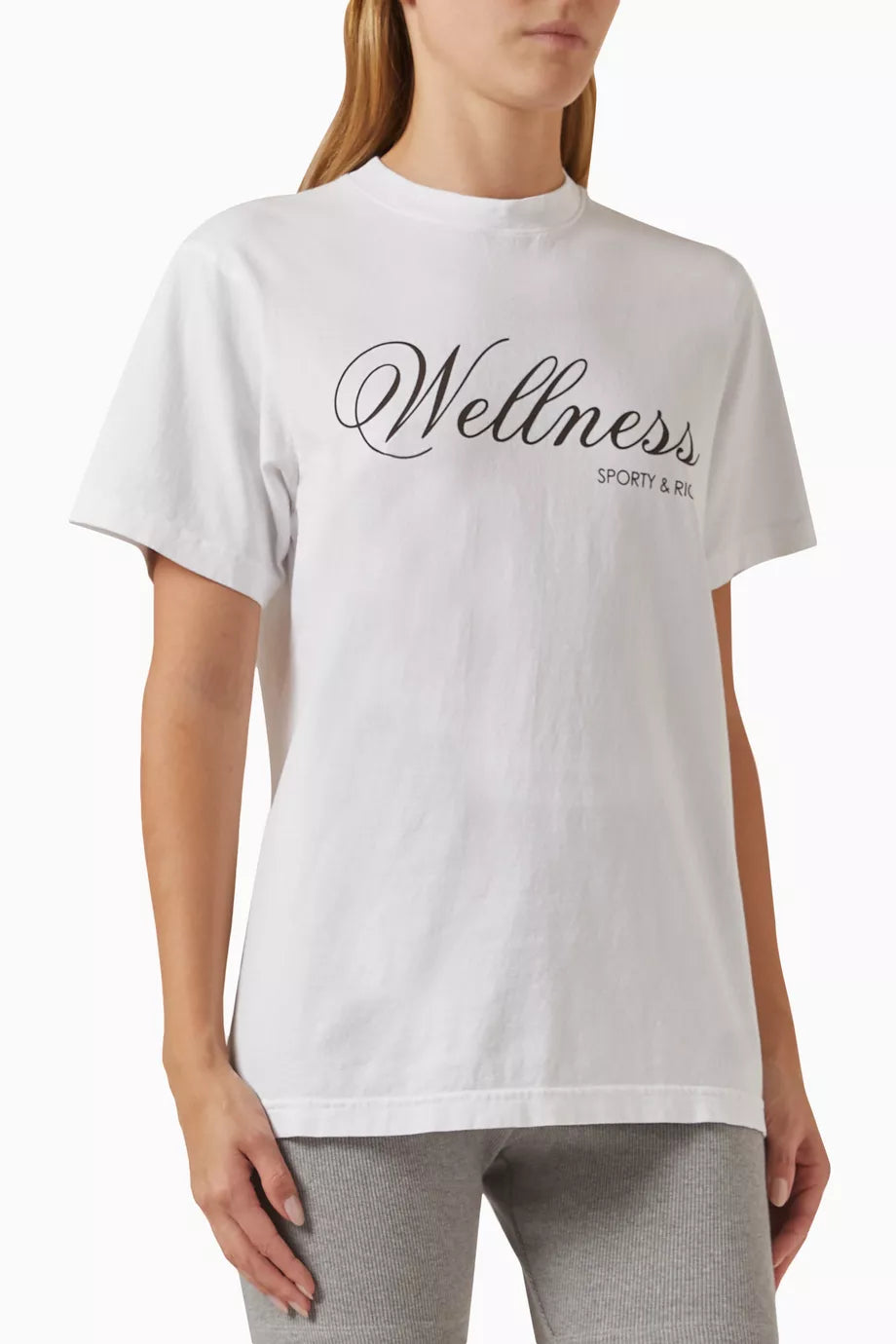 SPORTY & RICH white t-shirt "wellness" in black cursive writing