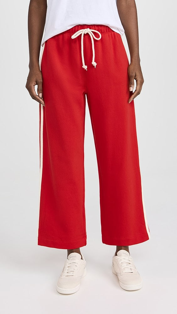 DONNI red sweatpants with white stripes and drawstring