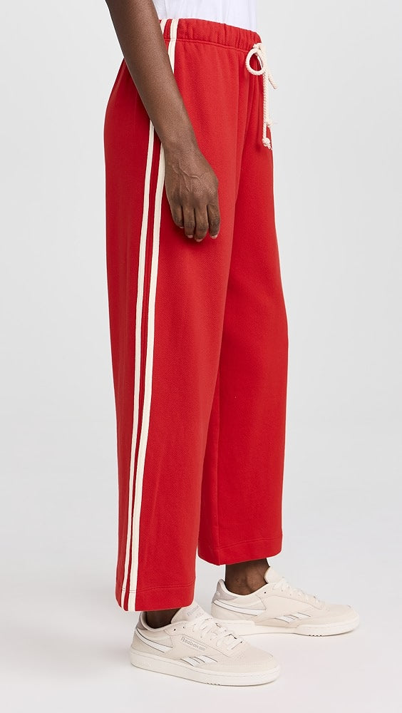 DONNI red sweatpants with white stripes and drawstring