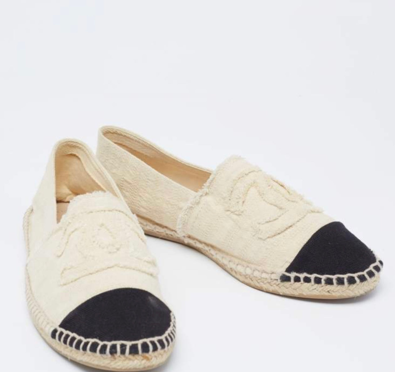 Pre-Loved Chanel™
- Off White/Black Canvas CC Cap Toe Espadrille Flats