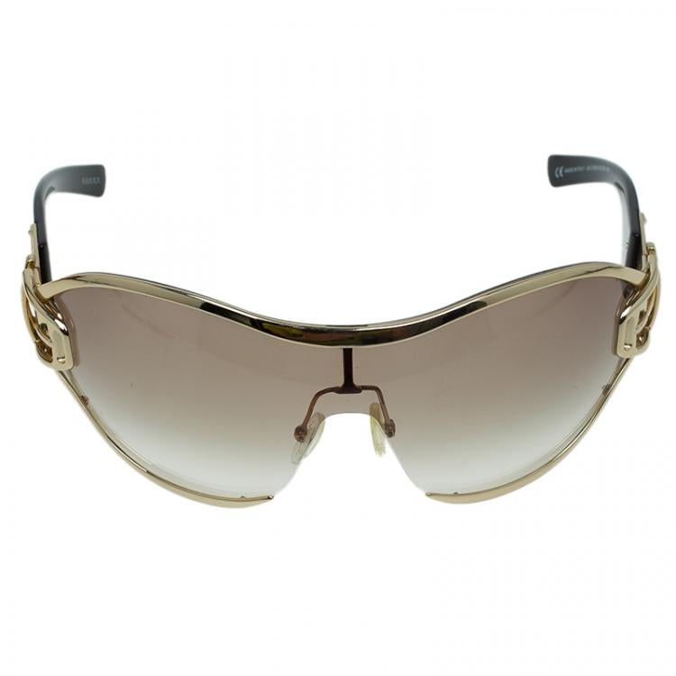 GUCCI large frame sunglesses, gold rim, gold side that looks like belt buckle