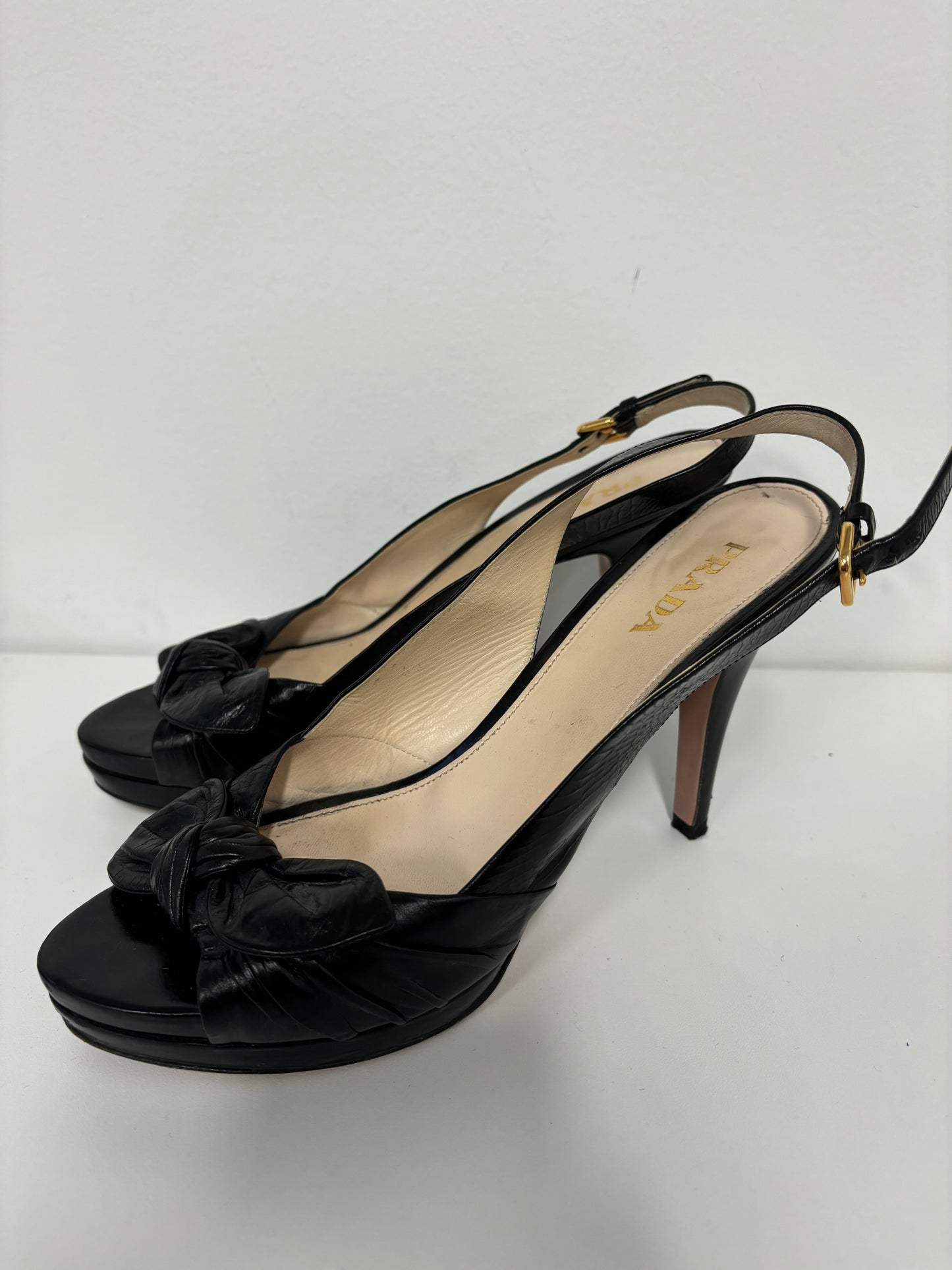 PRADA black ankle strap pumps with floral detail