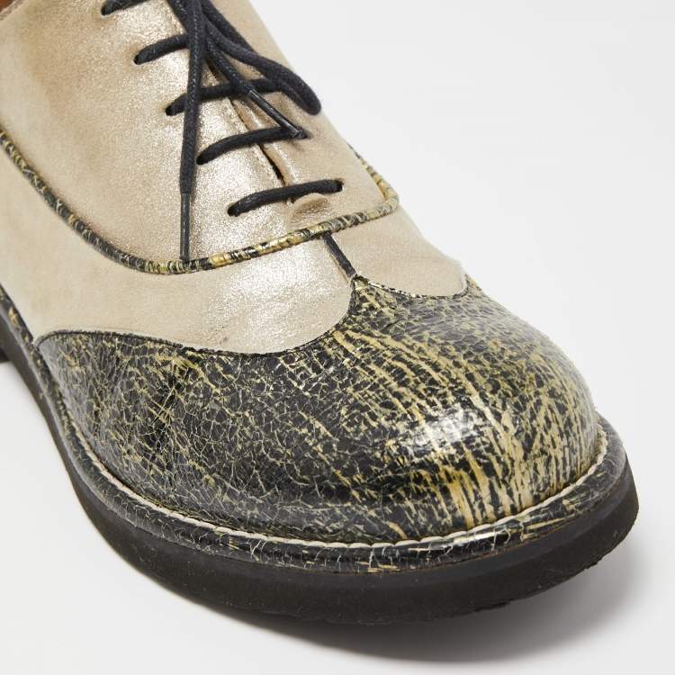 CHANEL womens dress shoe, gold with black pattern toe