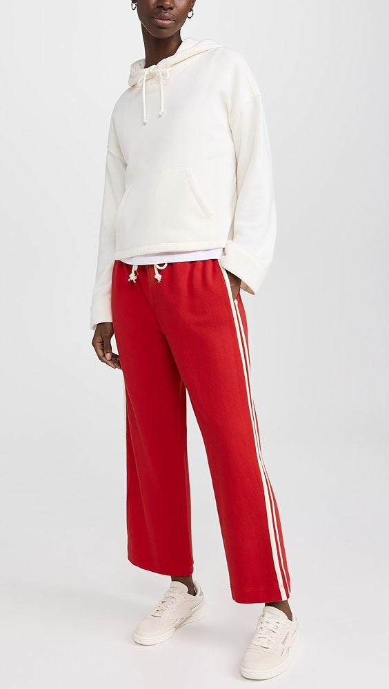 DONNI red sweatpants with white stripes and drawstring
