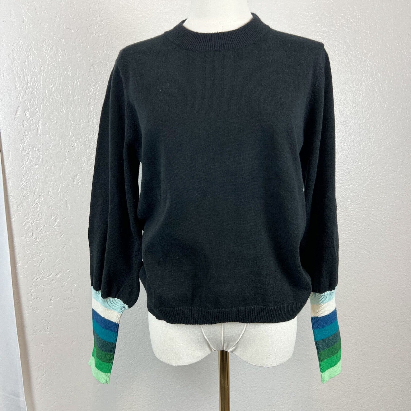 WISPR black sweater with green, blue stripes on sleeves
