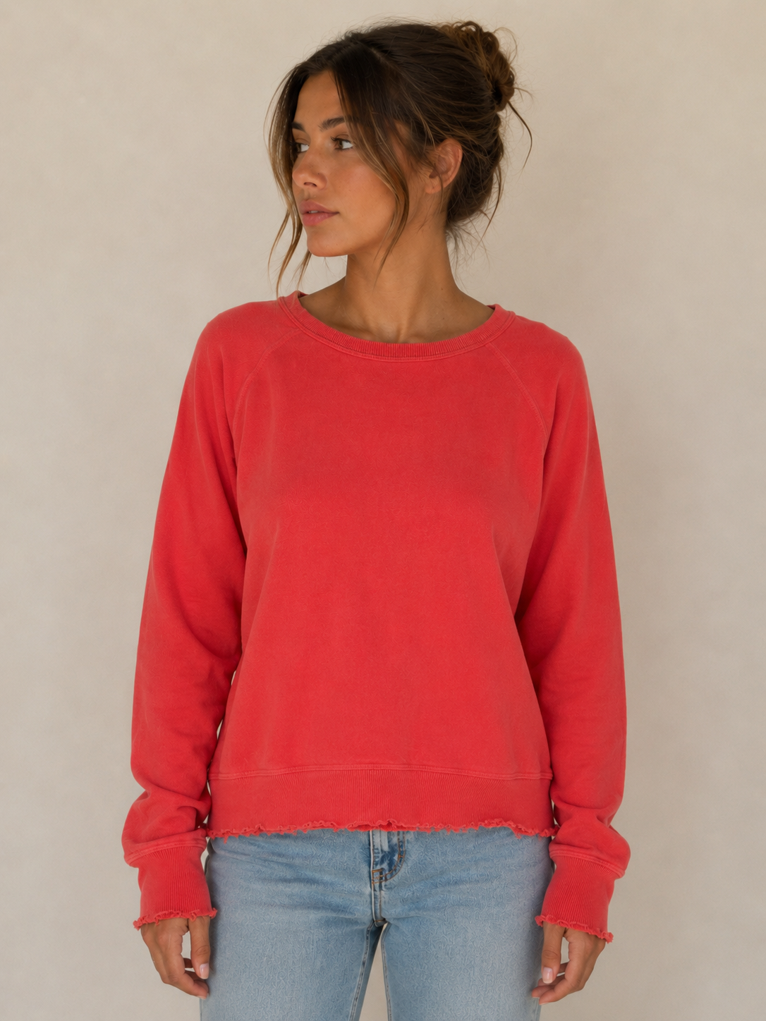 THE GREAT bright coral crewneck sweater with distressing