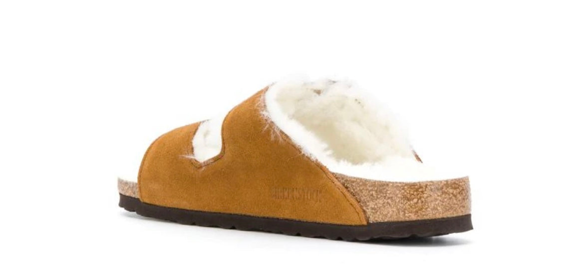 BIRKENSTOCK tan shearling clogs