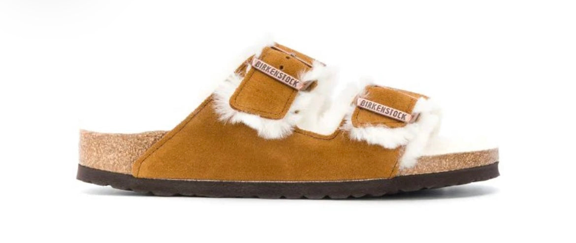 BIRKENSTOCK tan shearling clogs