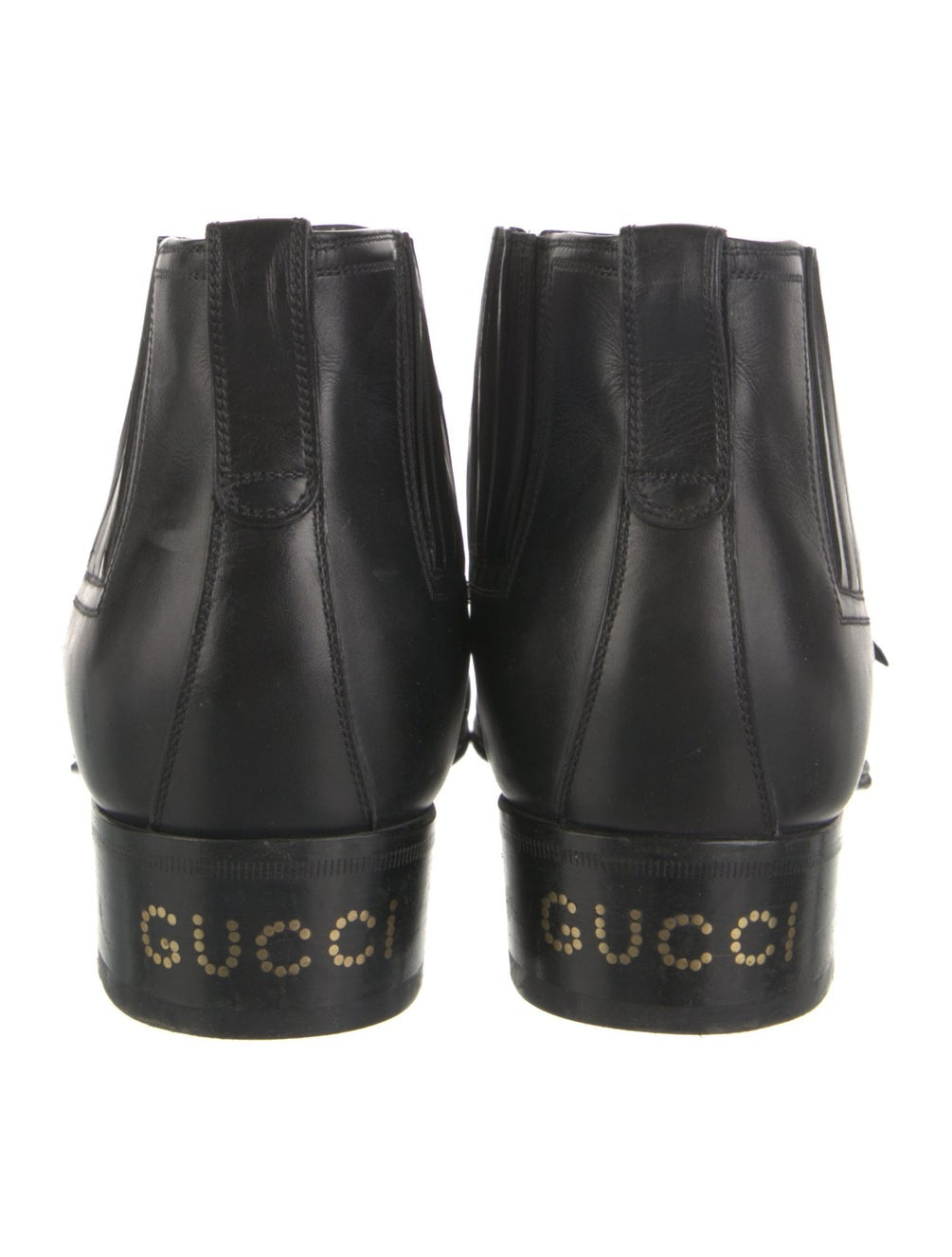 GUCCI black booties with gold buckle