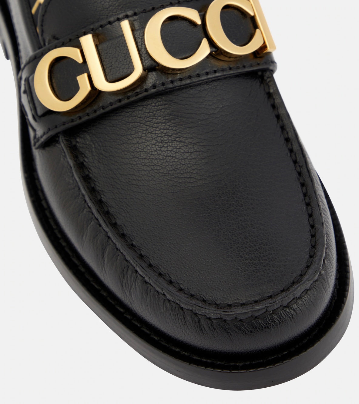 GUCCI
Logo leather loafers