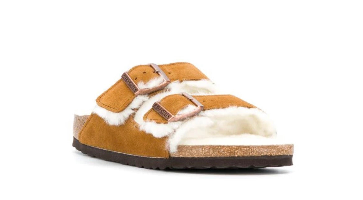 BIRKENSTOCK tan shearling clogs