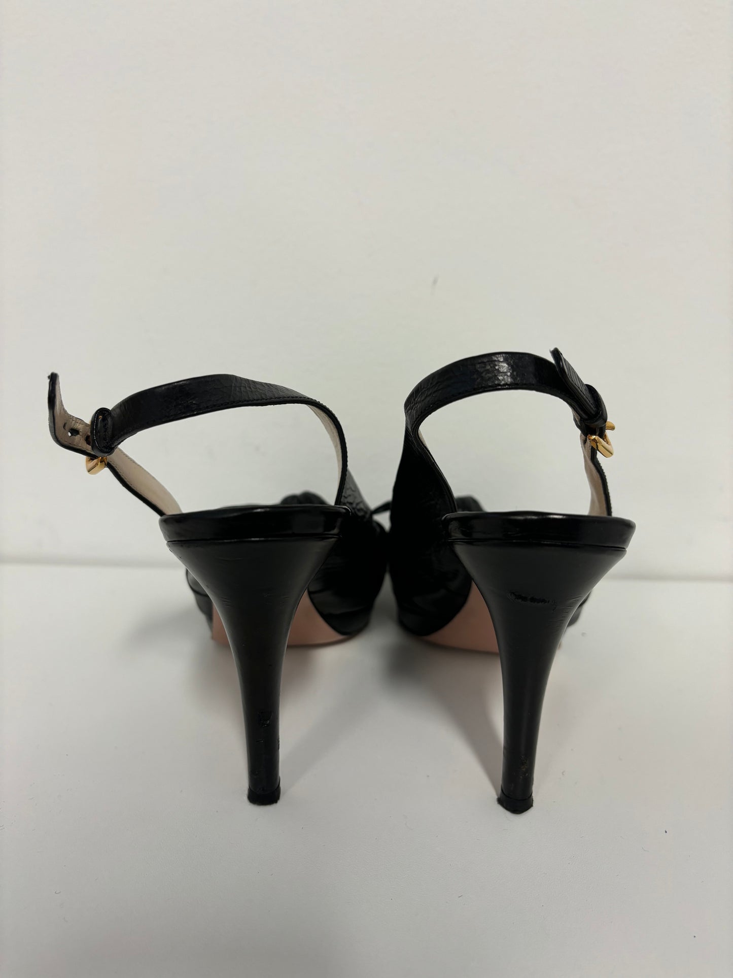 PRADA black ankle strap pumps with floral detail