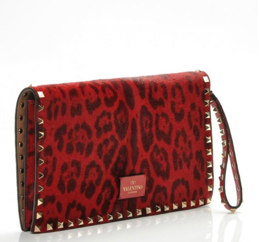 VALENTINO GARAVANI 
Calf Hair Leopard Print Rockstud Wristlet Clutch Red