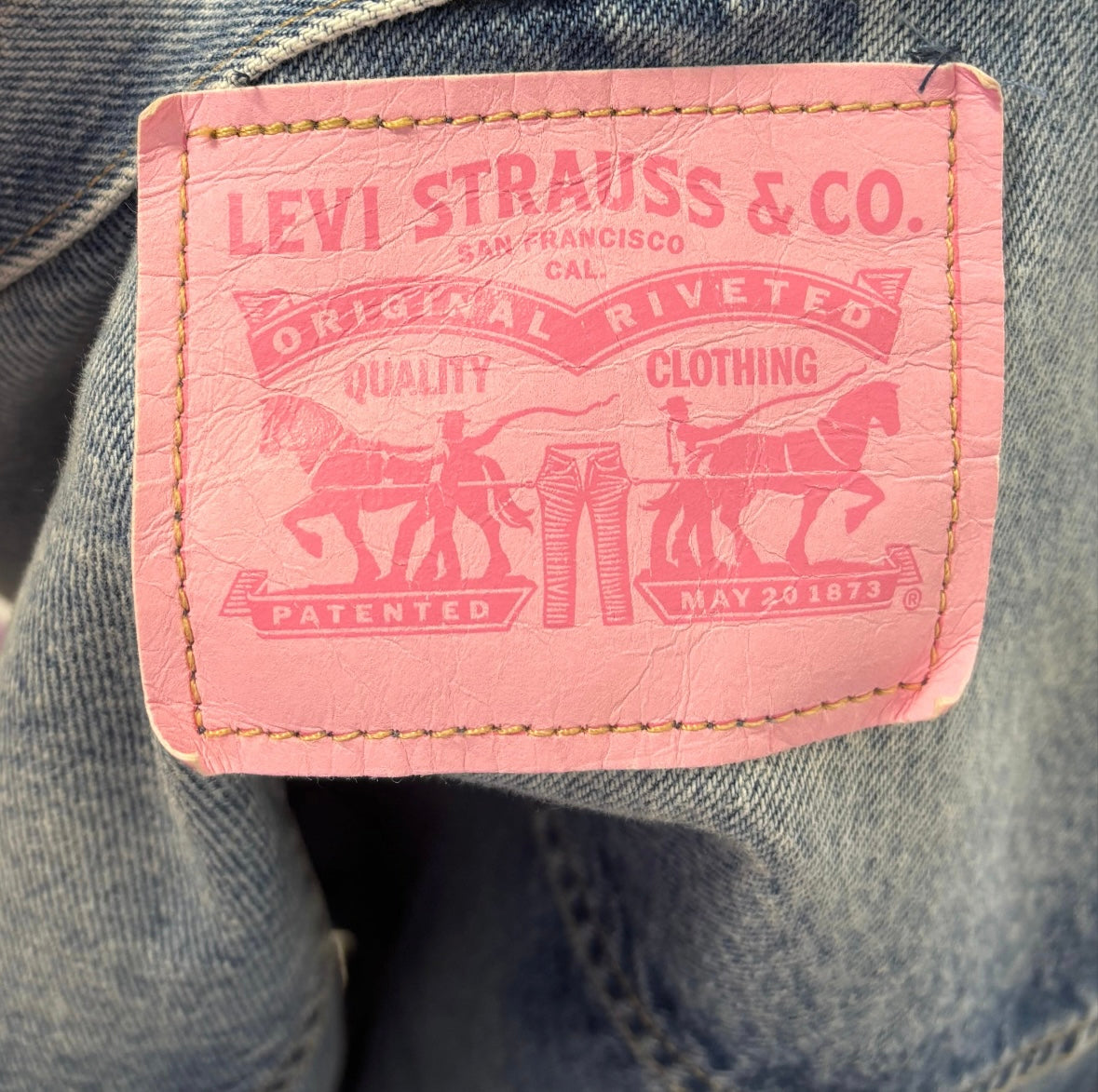LEVI'S cropped denim jacket with multi colour buttons and pink tag on back