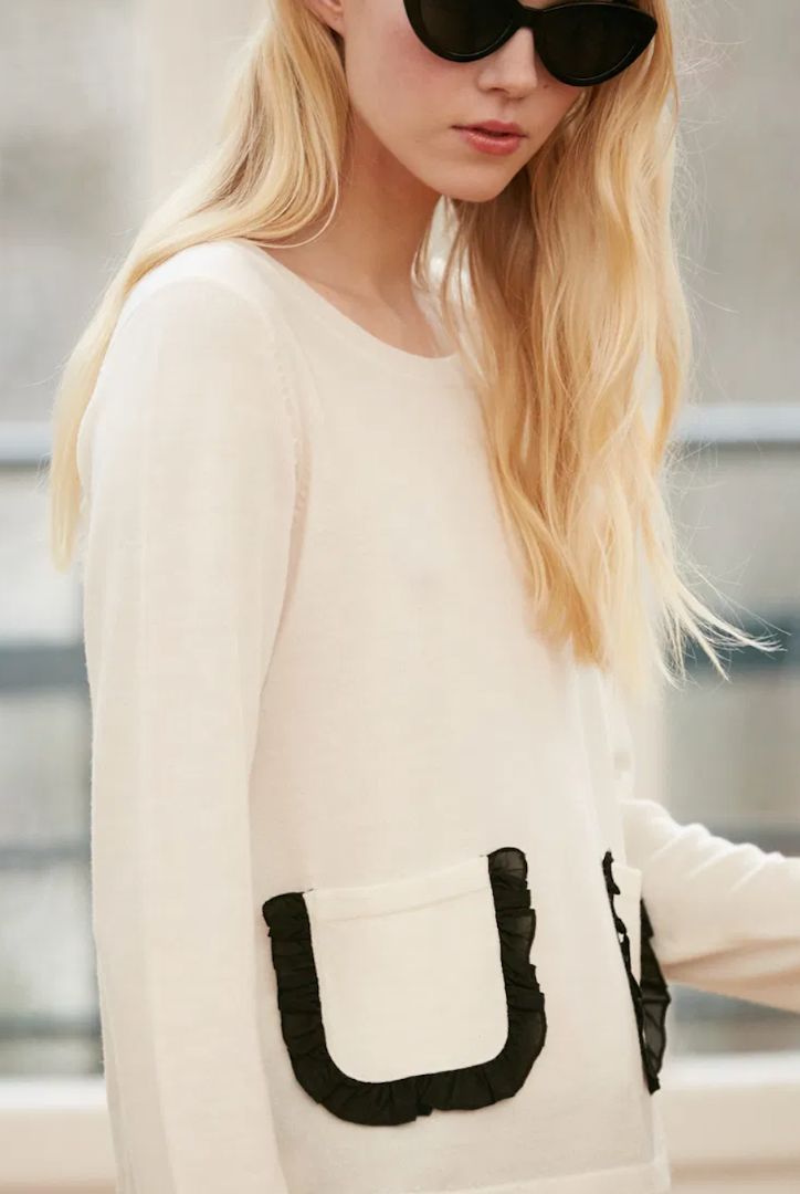 CLAUDIE PIERLOT cream knit with black ruffle pockets