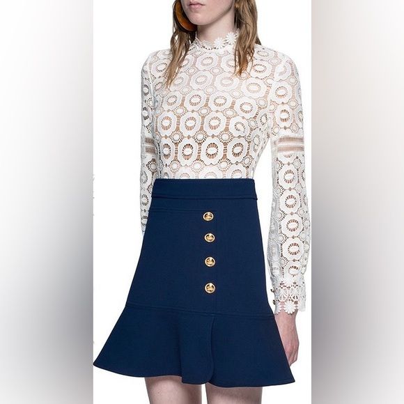 SELF PORTRAIT mini dress, top is white long sleeve eyelet design, bottom is blue w white buttons